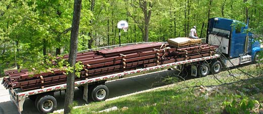 Steel framed home kit delivered on 50-foot flatbed trailer